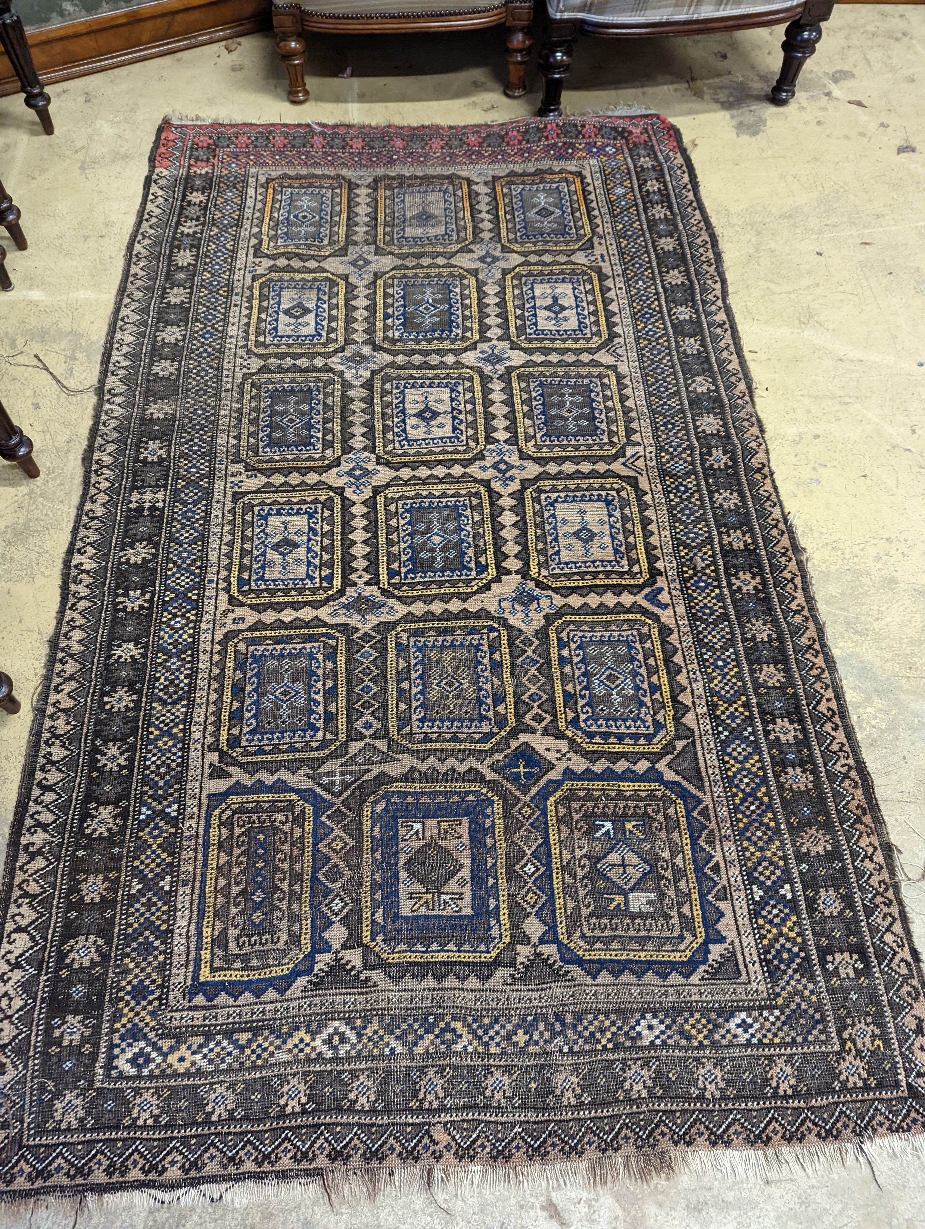 A Belouch geometric rug, 216 x 130cm. together with four Kelim cushion covers